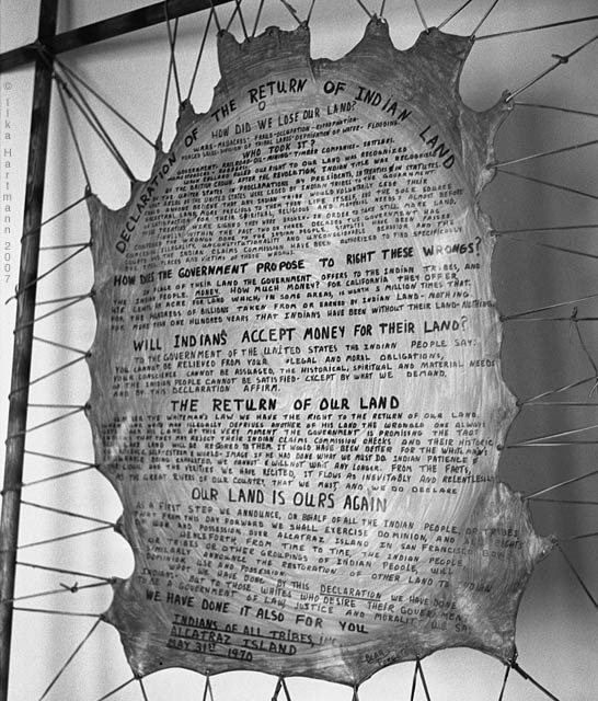 Black and white photograph of AIM’s proclamation written on stretched animal skin.
