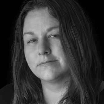 Black and white photograph headshot of artist Julie Buffalohead.
