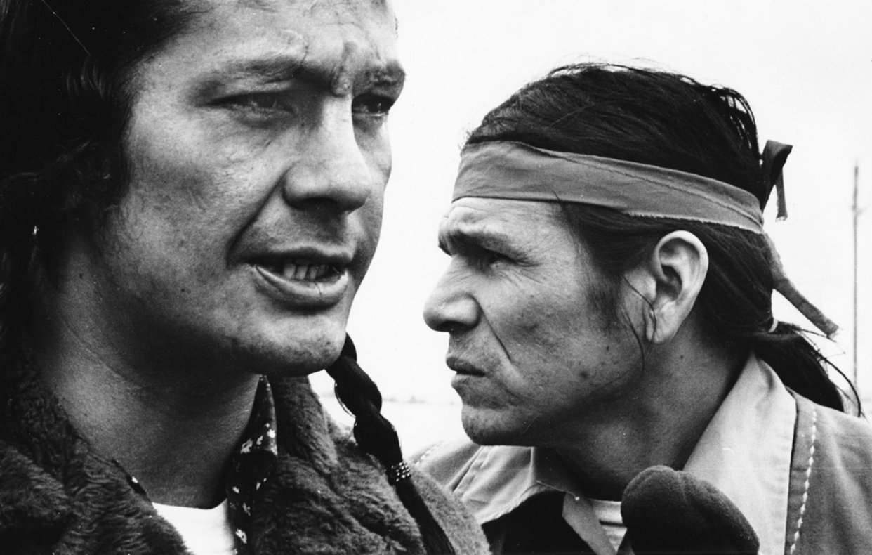 Close up black and white photograph of Russell Means (left) and Dennis Banks (right) during the occupation of Wounded Knee.