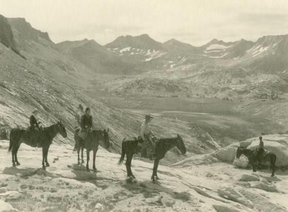 Four Horseback Riders in a Mountain Landscape