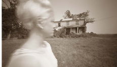 King William County, Virginia; Woman in White by an Abandoned House